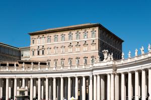 The Apostolic Palace is seen behind Bernini’s colonnade in St. Peter’s Square, Vatican City.