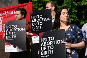 Supporters of the pro-life group "The Society for the Protection of Unborn Children" (SPUC) demonstrate against the the proposed decriminalization of abortion, outside the Houses of Parliament on June 17, 2025 in London, England. 