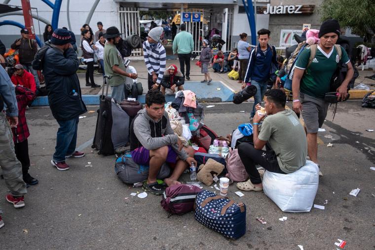Central American migrants, mostly Hondurans, who trekked for over a month in the hopes of reaching the United States, remain outside a temporary shelter in Tijuana, Baja California State, Mexico, near the border with the U.S., on Nov. 30, 2018.