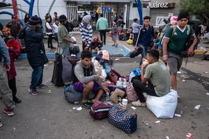 Central American migrants, mostly Hondurans, who trekked for over a month in the hopes of reaching the United States, remain outside a temporary shelter in Tijuana, Baja California State, Mexico, near the border with the U.S., on Nov. 30, 2018.