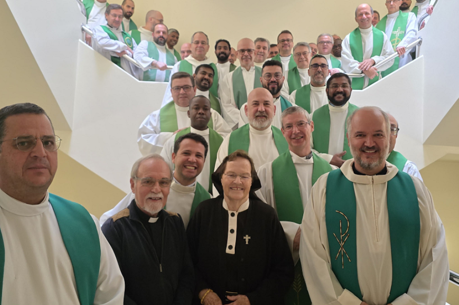Sister Briege McKenna poses with priests during a retreat in Fatima, Portugal 2024. 