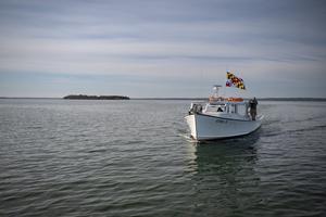 Captain Phil Langley gently guides the FV Lisa S to the awaiting pier to transport passengers to St. Clements Island on Maryland Day 2026.
