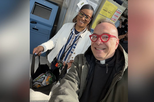 Father Jim Sichko delivers gift cards to TSA agents while they worked without pay amid congressional funding negotiations. 