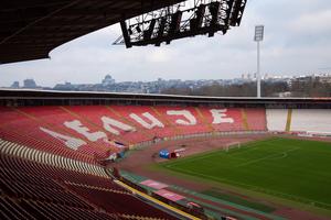 The Rajko Mitić Stadium in Belgrade, Serbia, home of Red Star Belgrade. The Cyrillic lettering “Делије” (“Delije”) marks the North Stand, where fans displayed an Orthodox Christian icon during a Europa League match on Feb. 26, 2026.