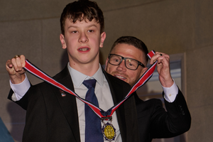 2026 Young Hero Honoree Victor Greenawalt receives a Medal of Honor from Kyle Carpenter, a former medal recipient during the 2026 Citizen Honors Awards ceremony at the Andrew W. Mellon Auditorium in Washington, D.C.
