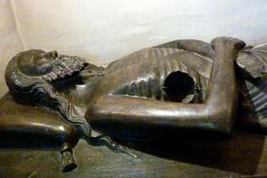 This recumbent Christ sculpture in Saverne, France, features a circular opening in the chest, likely used to hold the Blessed Sacrament on Holy Thursday.