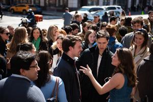 Young adults congregate in fellowship outside of St. Joseph Catholic Church in Greenwich Village. 