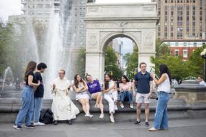 NYU Catholic students gather in Washington Square Park with Dominican Father Vincent Bernhard.