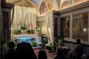Pilgrims pray in adoration before the altar of repose at the Church of St. Brigid in Rome on April 2, 2026. 