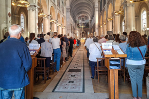 Faithful attend Mass at Notre-Dame-des-Champs Catholic Church in the 6th arrondissement of Paris, France, Sunday, Sept. 7, 2025. 