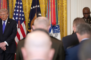 U.S. President Donald Trump bows his head as U.S. Army Chief of Chaplains Maj. Gen. William Green Jr. (right) delivers a benediction during a Medal of Honor Ceremony in the East Room of the White House on March 2, 2026, in Washington, D.C.  