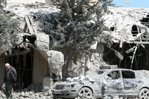 A man checks the site of an Israeli airstrike on April 9, 2026, that targeted a religious Shiite complex the day before in the southern Lebanese coastal city of Sidon. 