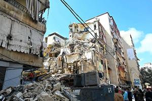 This photograph taken on April 10, 2026, during a media tour organized by Hezbollah's media office shows a digger clearing the rubble of a building in Beirut’s Hay al-Selloum neighborhood that was targeted in an Israeli strike earlier this week.