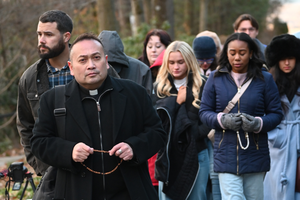 Father Leo Patalinghug leads some 'Catholic-curious' influencers in the Rosary while on pilgrimage visiting some sacred sites in and around Baltimore, Md.