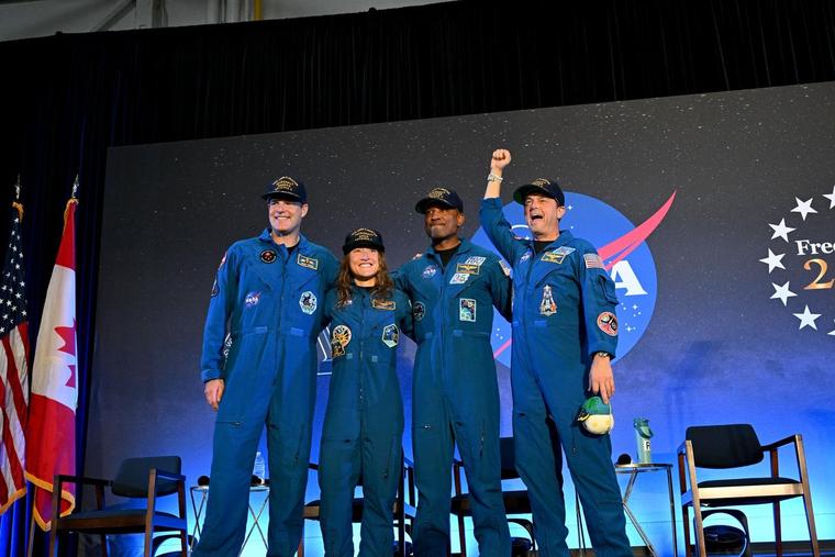 NASA’s Artemis II crew, (left to right) NASA astronauts Reid Wiseman, commander; Christina Koch, mission specialist; Victor Glover, pilot; and CSA (Canadian Space Agency) astronaut Jeremy Hansen, share brief remarks with friends, family, and colleagues after they landed at Ellington Airport near NASA’s Johnson Space Center in Houston on Saturday, April 11, 2026, after a nearly 10-day journey around the moon and back to Earth. 