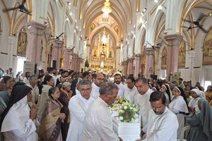 Priests carry the body of Father Francis Alappatt from the Basilica of Our Lady of Dolours in Thrissur, India, after his funeral service on April 10, 2026. 