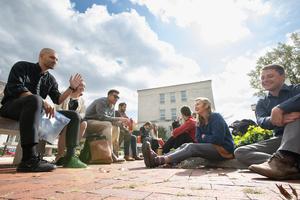 Students share a moment of laughter and camaraderie on the campus of Catholic University between classes.