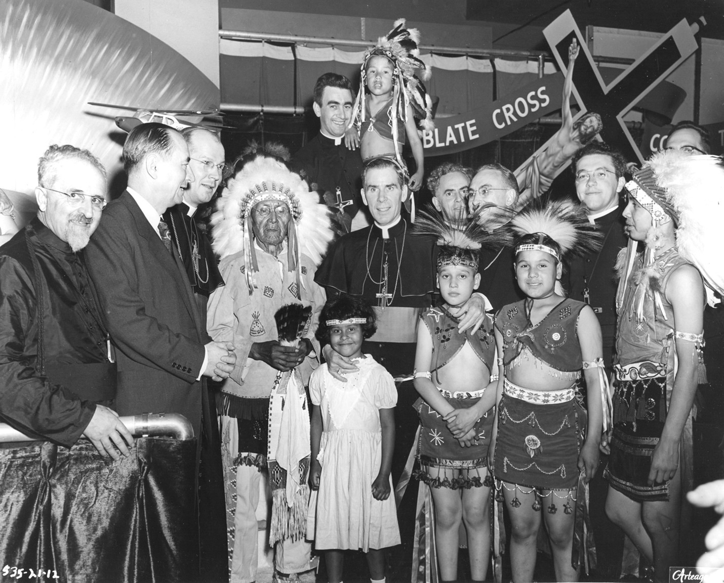 Archbishop Sheen with missionaries, 1953 St. Louis exhibition
