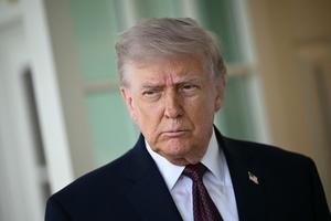 President Donald Trump speaks to the press outside the Oval Office at the White House in Washington on April 13.