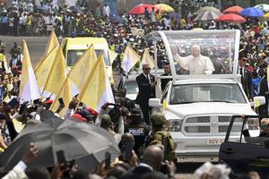 Pope Leo waves to the faithful gathered for Mass at Japoma Stadium in Douala, Cameroon, on April 17, 2026.