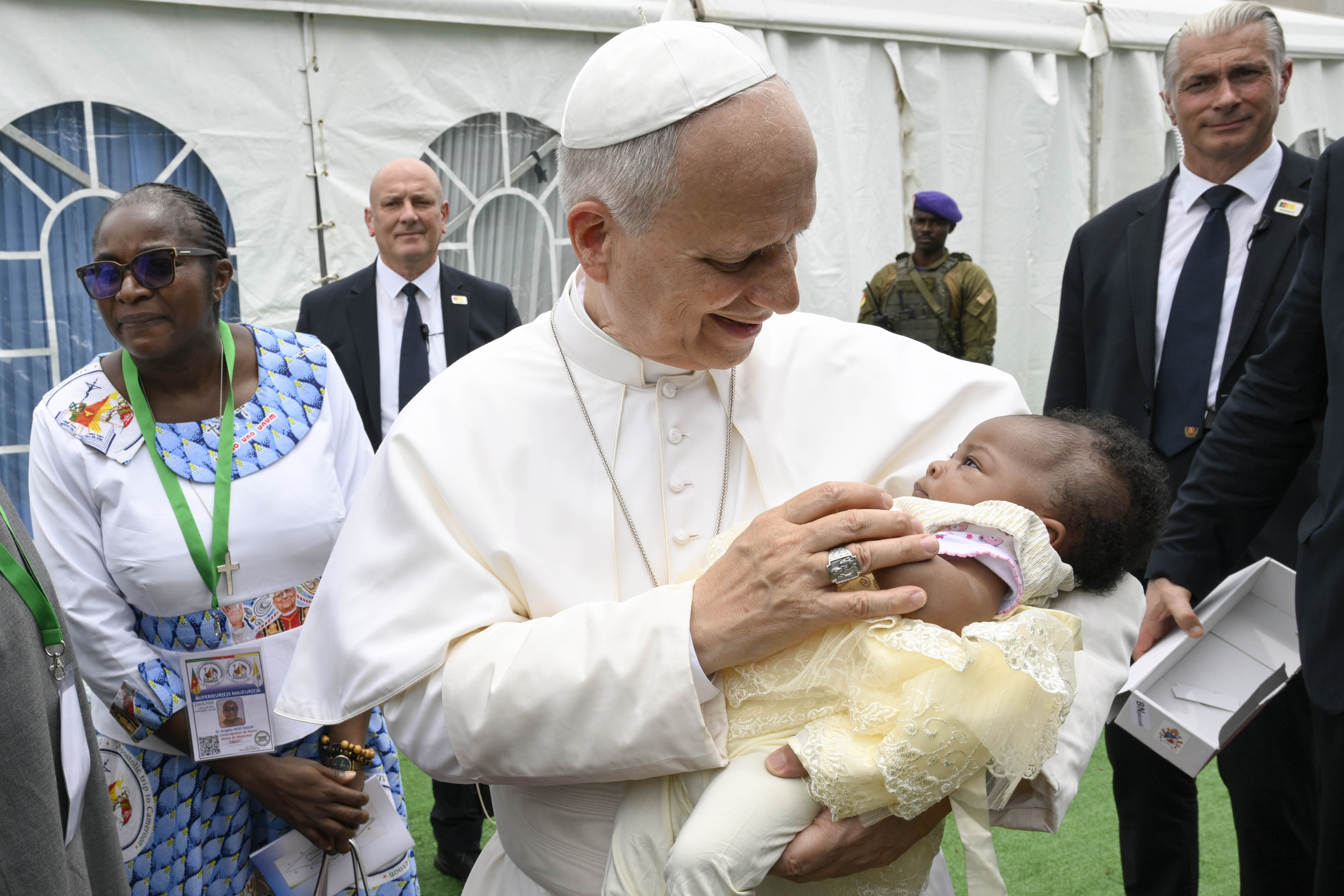 Pope Leo holds a baby in Cameroon