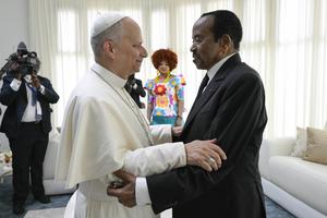Cameroonian first lady Chantel Biya looks on as Pope  Leo converses with President Paul Biya before  departing Cameroon on April  18, 2026.