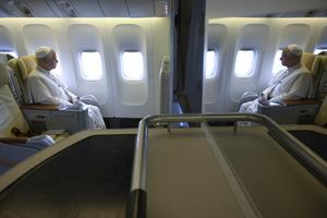 Pope Leo XIV looks out the window of the papal plane en route to Mengomeyén, Equatorial Guinea, Wednesday, April 22, 2026.