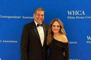 Erik Rosales and his wife Stacey pose for a photo along the red carpet at the White House Correspondents' Dinner in Washington, D.C.