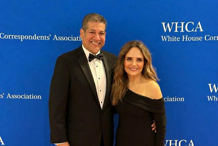 Erik Rosales and his wife Stacey pose for a photo along the red carpet at the White House Correspondents' Dinner in Washington, D.C.