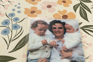 St. Gianna is shown with two of her children on a holy card.