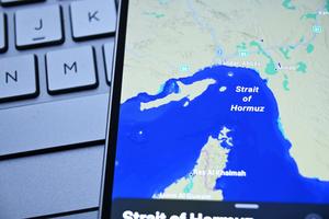 A photo displays am image of the Strait of Hormuz.