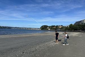 A couple of pilgrims from St. Charles Borromeo explore the beach in Miño, just a short walk from the Camino. 