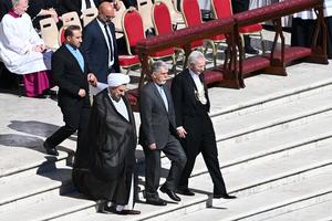 Iranian Minister of Culture and Islamic Guidance Seyyed Abbas Salehi (3L) walks with Iranian Ambassador to the Vatican Mohammad Hossein Mokhtari (2L) as they arrive ahead of late Pope Francis' funeral in St. Peter's Square at the Vatican on April 26, 2025.      