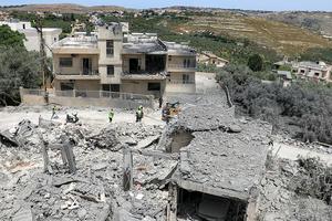 First responders inspect damage following Israeli bombardment on the village of Deir Qanoun al-Nahr in southern Lebanon on May 17, 2026. 