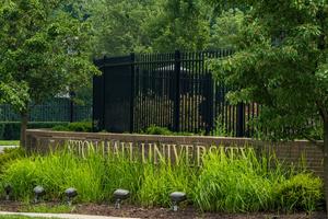 Grass grows at the entrance to Seton Hall University in South Orange, New Jersey, July 26, 2025