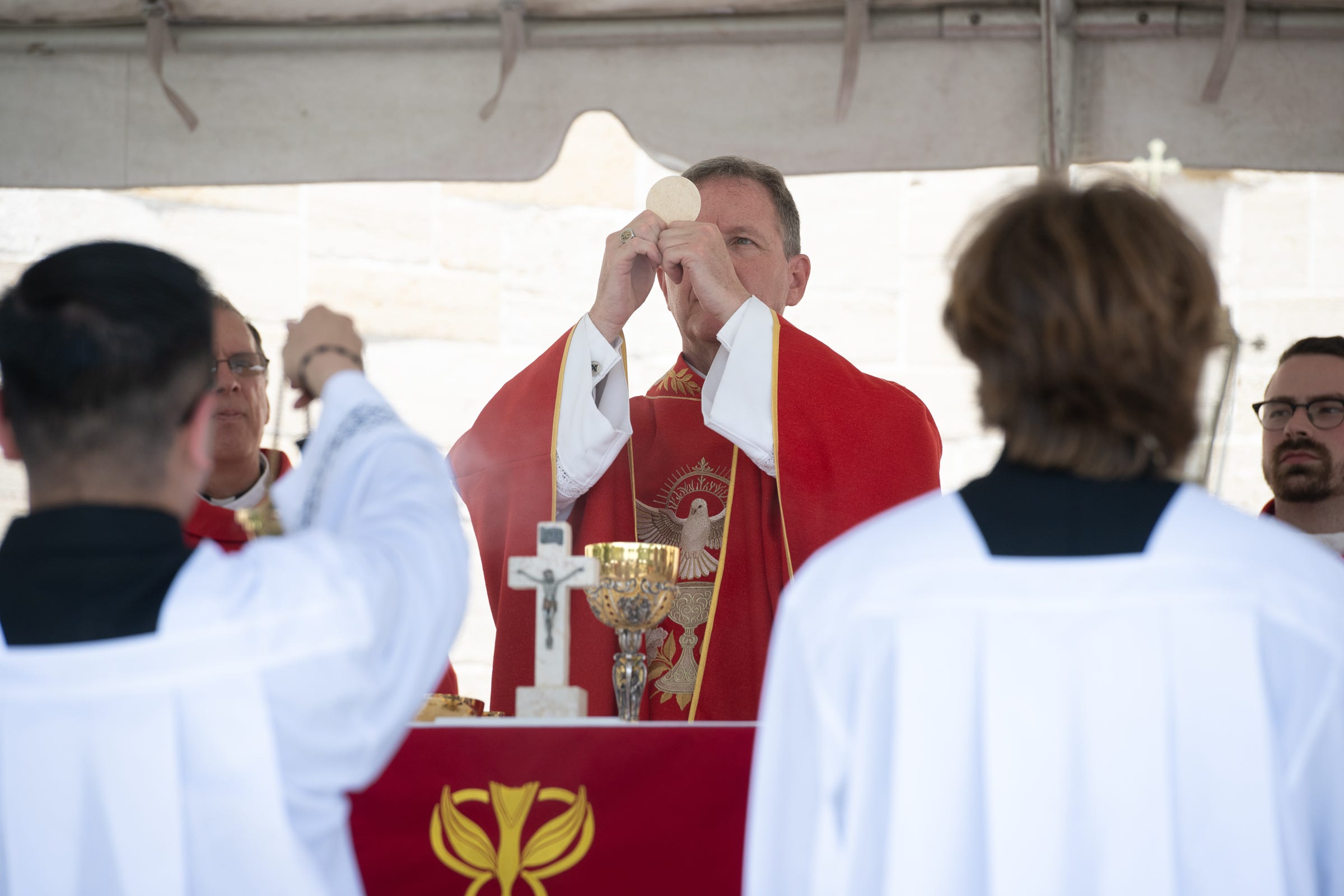 The host is elevated during consecration. 
