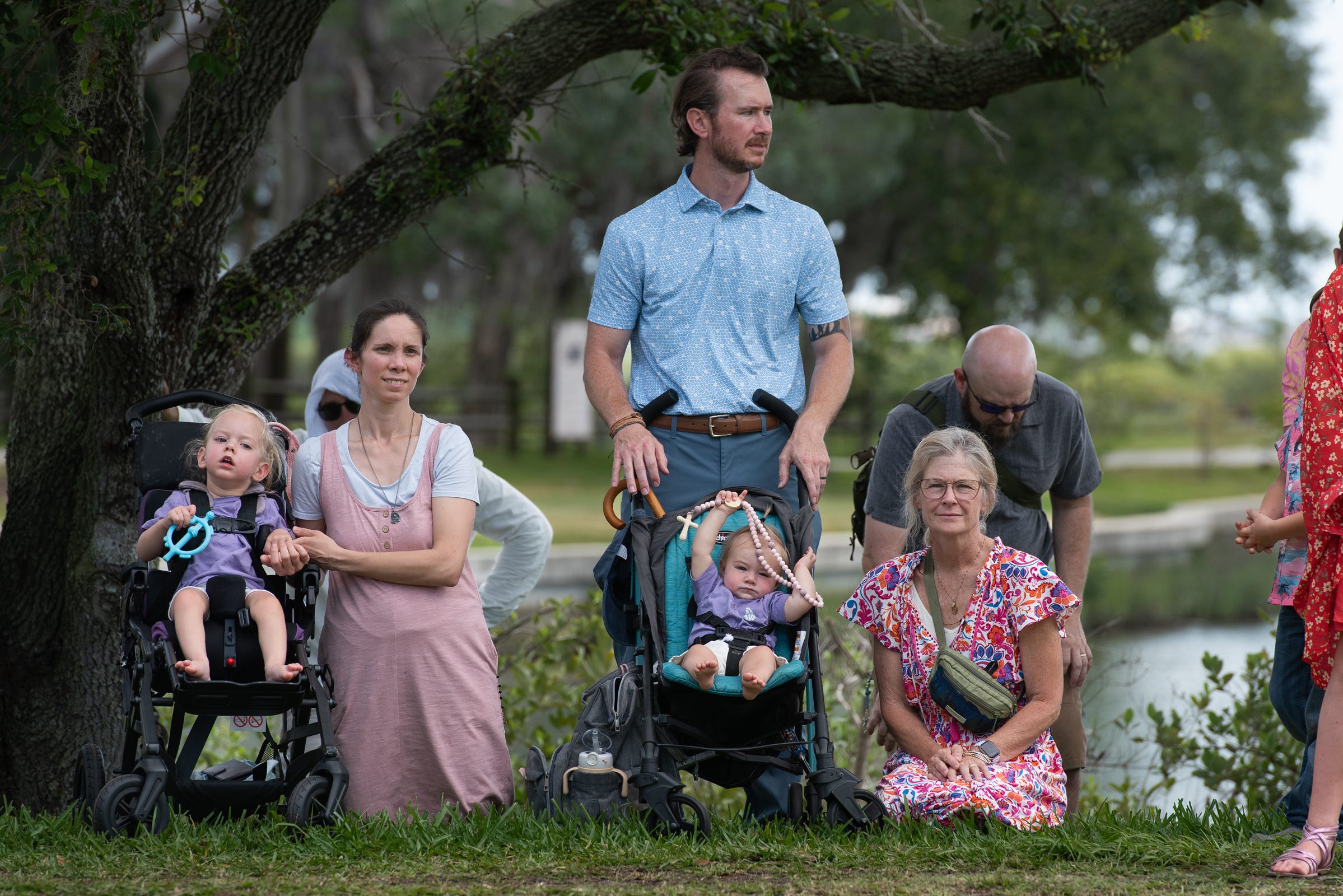 Families lined the route, strollers, rosaries, tired children, and all, as Christ passed by.