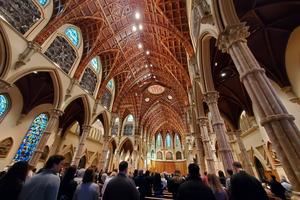 People stand in Chicago’s Holy Name Cathedral on Feb. 12, 2023.