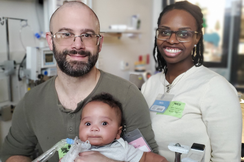 Greg and Keishera Joubert smile proudly holding their little miracle baby Cassian. 