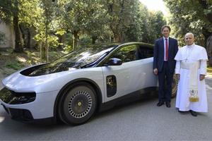 Pope Leo XIV and Ferrari chairman John Elkann stand next to the brand-new Ferrari Luce, the Italian luxury sports car manufacturer’s first fully electric car, at Castel Gandolfo, south of Rome, Italy, on May 26, 2026. 