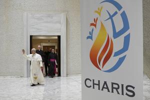 Pope Leo XIV waves to participants at his first meeting with the Catholic Charismatic Renewal on May 30, 2026, in the Paul VI Audience Hall at the Vatican. 