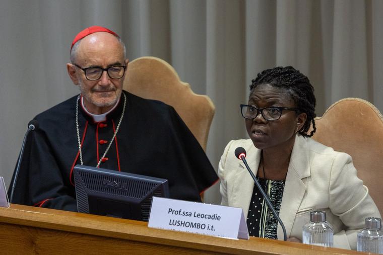 Catholic theologian Léocadie Lushombo speaks during the presentation of Pope Leo’s first encyclical on May 25, 2026, at the Vatican as Cardinal Michael Czerny listens.