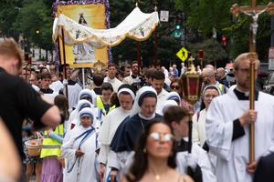 Pilgrims follow the Blessed Sacrament during a Eucharistic procession in Washington, D.C., June 6, 2026. 
