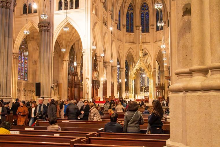 People leave the pews in St. Patrick’s Cathedral in New York City after Mass on Nov. 10, 2019. 