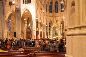 People leave the pews in St. Patrick’s Cathedral in New York City after Mass on Nov. 10, 2019. 