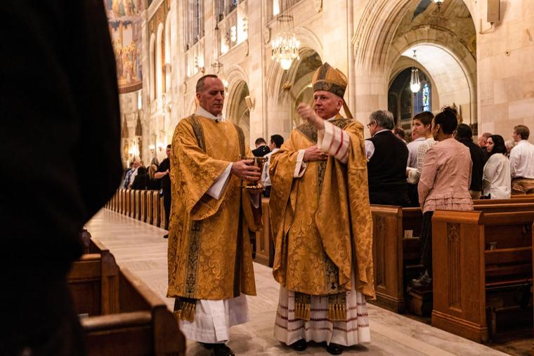 Toledo Bishop Daniel E. Thomas, right, blesses the faithful at the Easter morning Mass at Our Lady, Queen of the Most Holy Rosary Cathedral in 2022. 