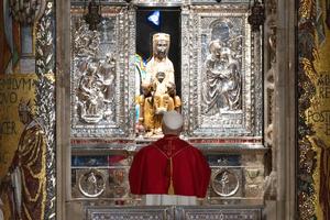 Pope Leo XIV venerates a 12th-century wooden sculpture of Mary with the Child Jesus in the Abbey of Montserrat, outside of Barcelona, Spain, on June 10, 2026. 