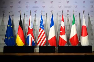 Flags of European Union, Germany, United Kingdom, the United States of America, France, Canada, Italy, and Japan. 