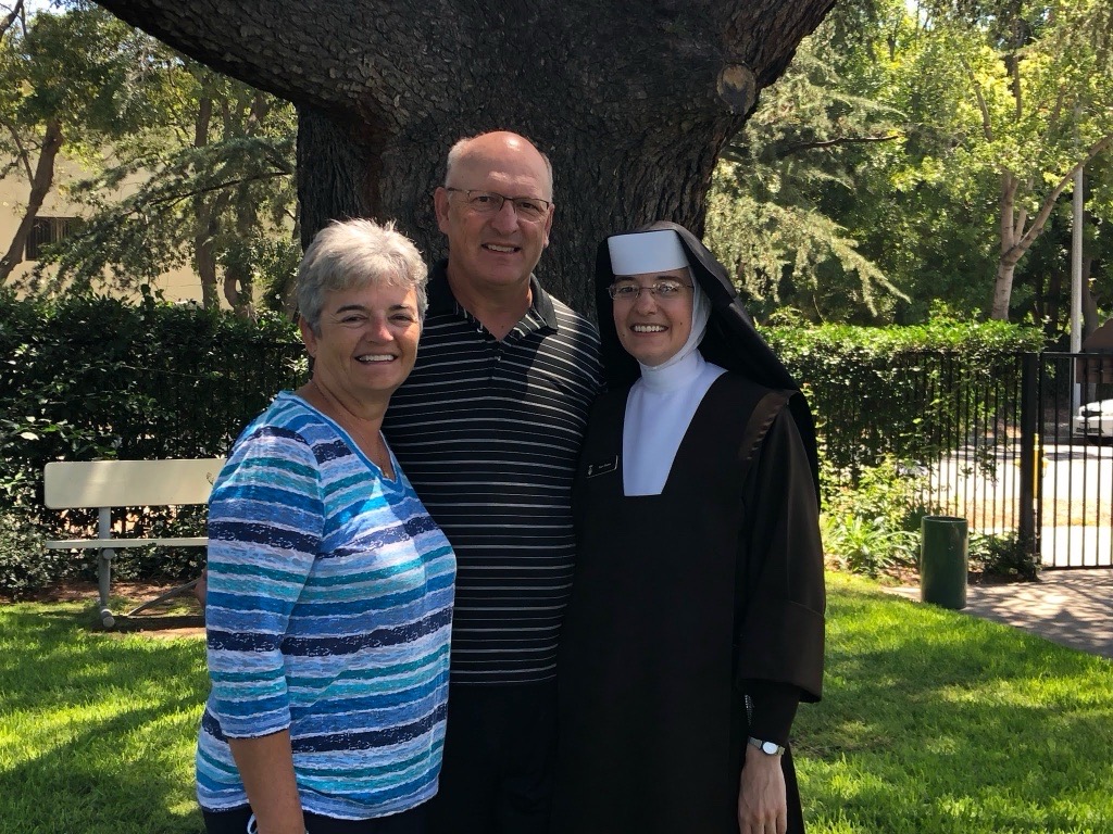 Sister Gianna of the Resurrection, whose name is inspired in
part by St. Gianna Beretta Molla, poses alongside her parents. (Photo: Courtesy of
Sister Gianna of the Resurrection)