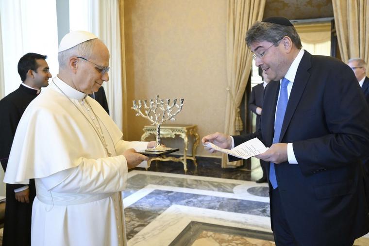 Pope Leo XIV receives a menorah from a representative of the United Jewish Appeal Federation of New York at the Apostolic Palace in the Vatican on June 15, 2026. 